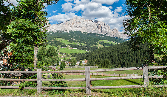 A Fence and, beyond, one glimpse of the mountains of Alta Badia